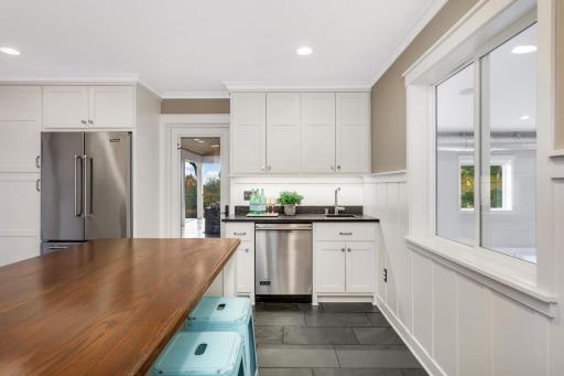 Peek into the sport court from the laundry room, or head out to the screened porch. This is one of two wet bars in this home, making entertainment so fun and easy.
