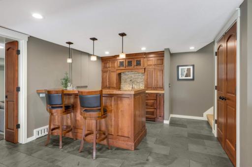 Enjoy a second wet bar with great storage and practicality.