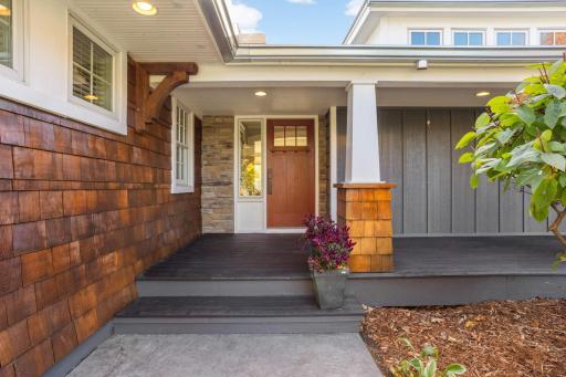 The stamped concrete walkway welcomes you home, and the galvanized steel industrial-grade gutters make a statement.
