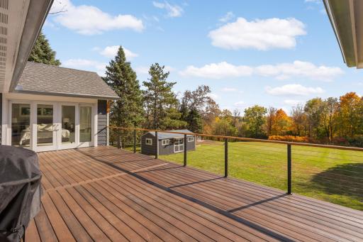 Start putting together your guest list for your housewarming party, because all your friends are going to want to see your new home. This back deck, which you can access from many rooms in the home, is going to be a hot spot this summer.