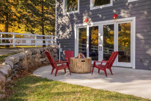 The lower-level patio is just off the sports court, perfect for hosting and roasting s'mores.