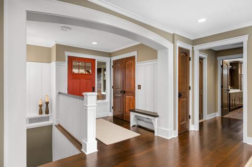 It's so convenient to have a place to sit down and put shoes on and a front closet for guests' coats.