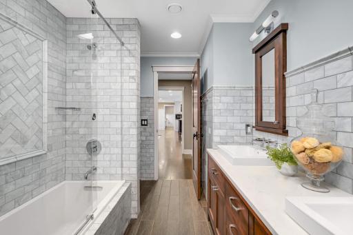 In keeping with the theme of the home, all the little details are perfection, including the gorgeous tile in the hallway bathroom.