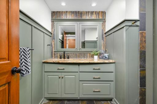 The board and batten detailing in this bathroom deserves a moment; she is a beauty.