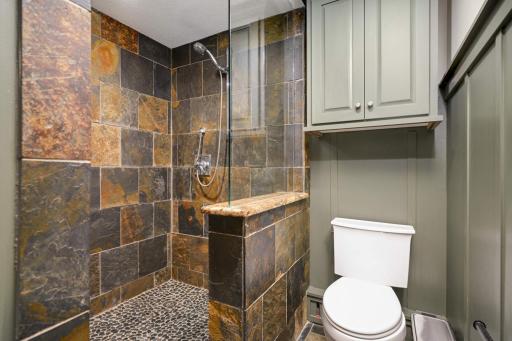 Enjoy a custom walk-in shower in the bathroom just off the lower level suite.