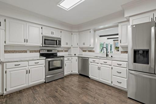 A spacious kitchen with tons of cabinet space and newer appliances.