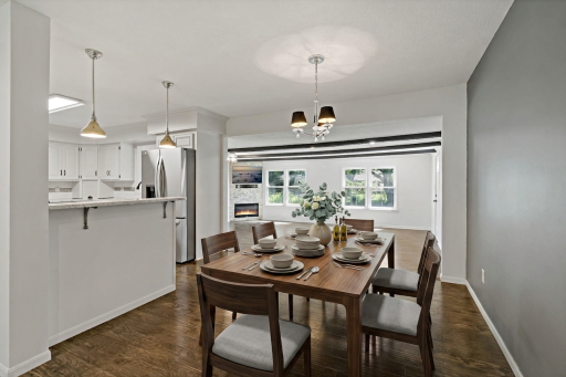 The dining room space is open to the kitchen and living rooms. It's perfect for a large rectangular table. This image has been virtually staged.