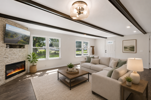 The back living room also includes a fireplace, plenty of natural light and access to the backyard. The room has been virtually staged.