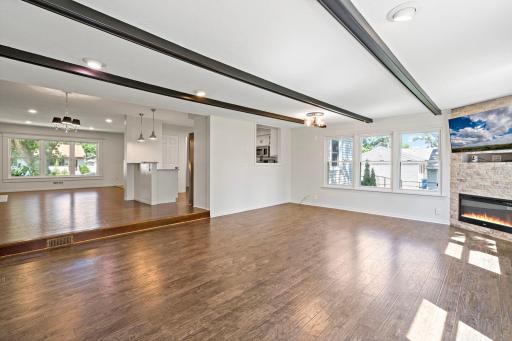 Empty back living room to show off the ceilings beams, beautiful flooring and natural light!