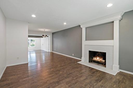 Empty front living room and dining space.
