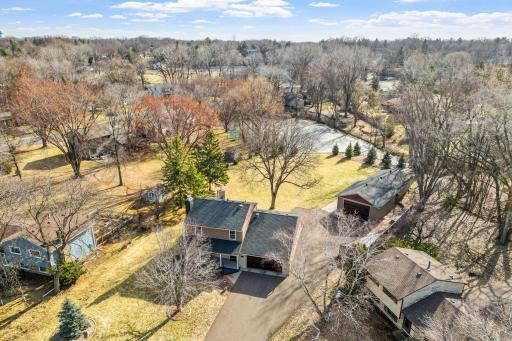 Garage Lover's Dream! 2-story home with 2 detached garages with 10' x 16' wide insulated garage door (connected with almost 66 feet front to back).