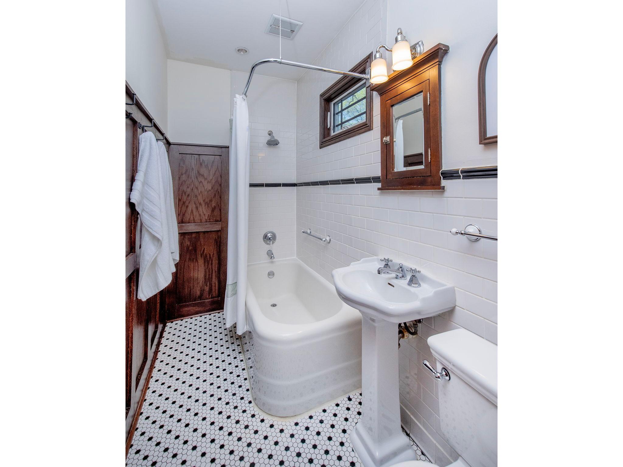Main floor full bathroom with traditional touches