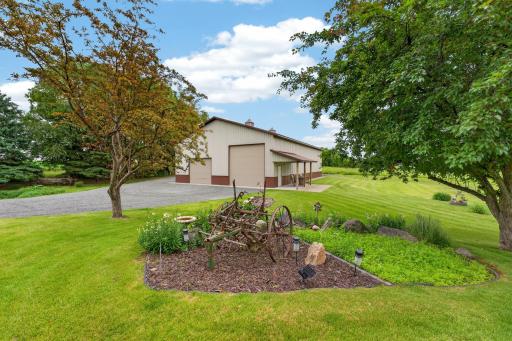 45 x 72 Pole barn with 100 amp service/cement floor (2) 14 ft overhead doors front and back makes easy drive through