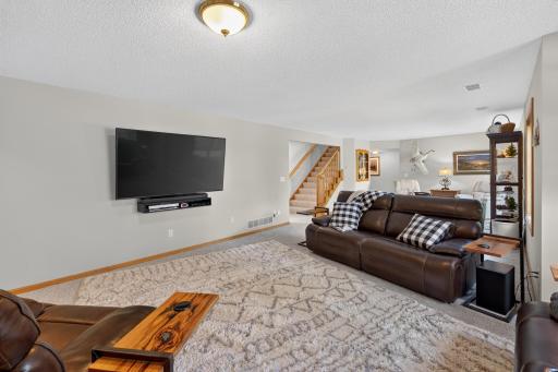 Family room - 75" TV and video player included in sale.
