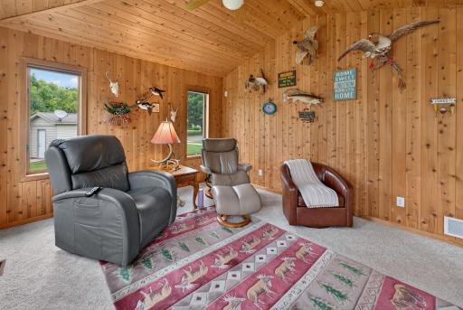Relax in the sunroom overlooking back yard