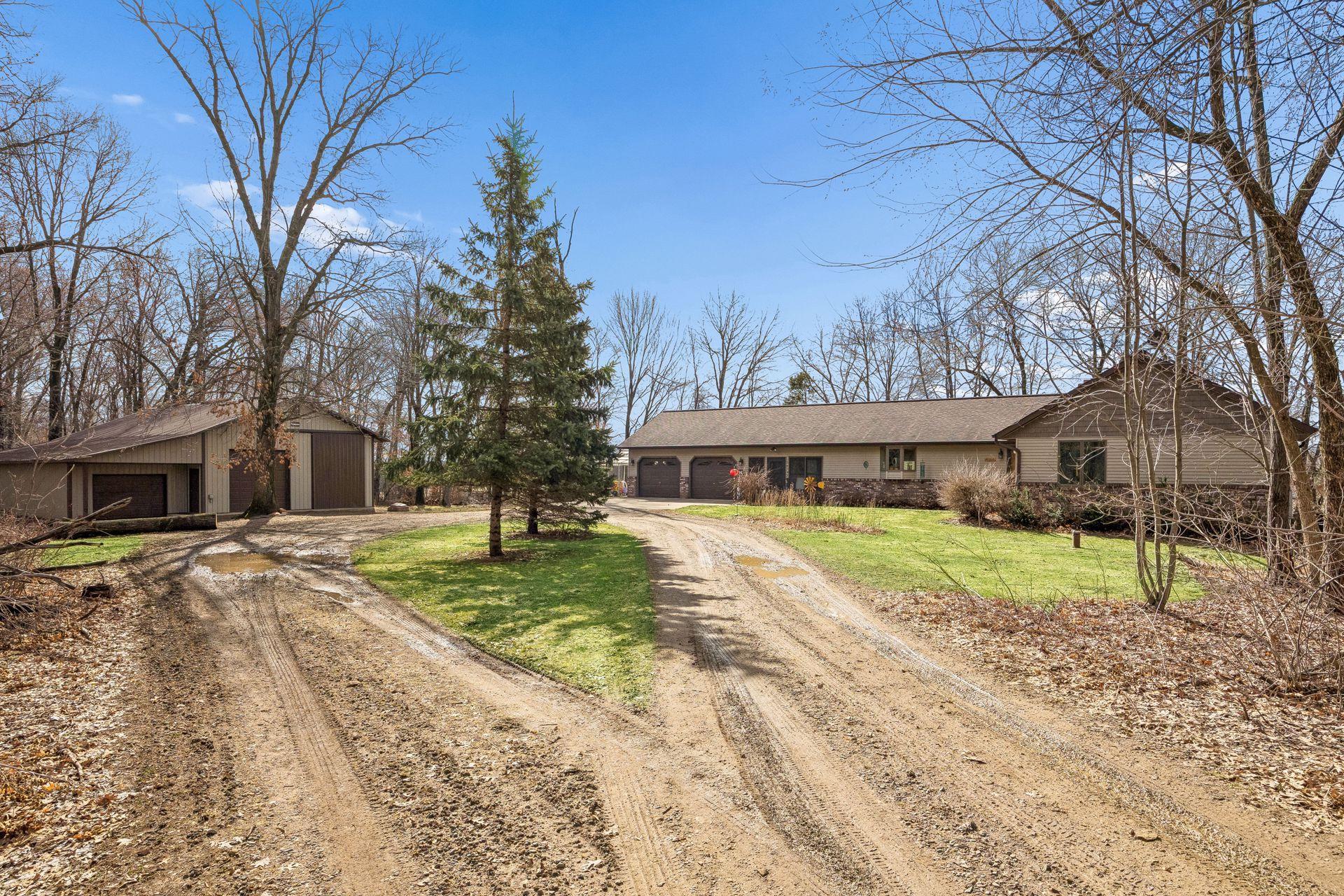 Welcome home! A wraparound driveway with a landscaped center island makes coming and going effortless.