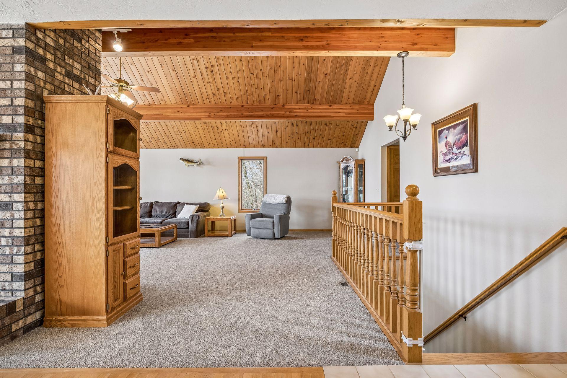 Seamless flow into the living room and main floor primary suite.