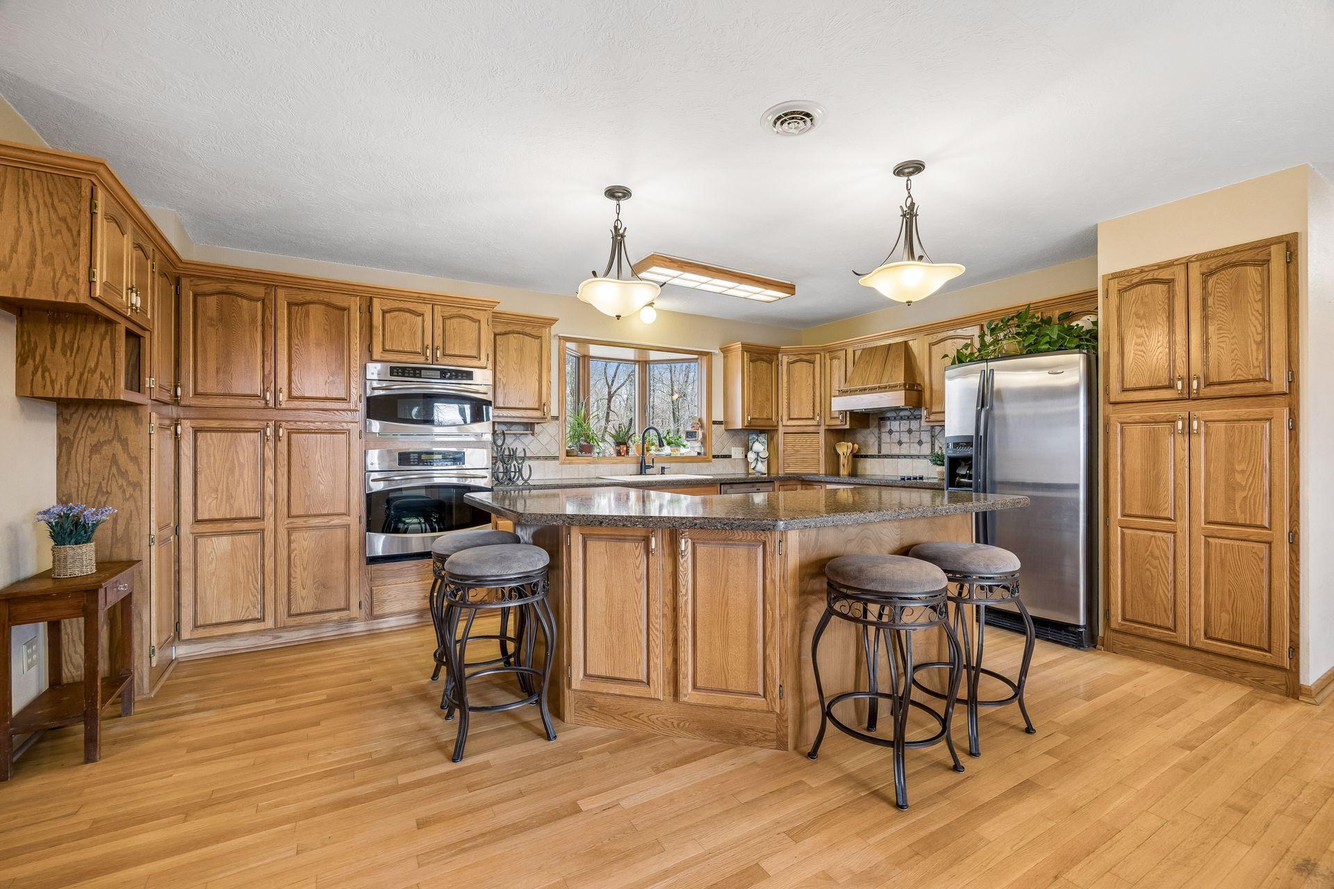 Kitchen features built-in oven and microwave for added convenience.