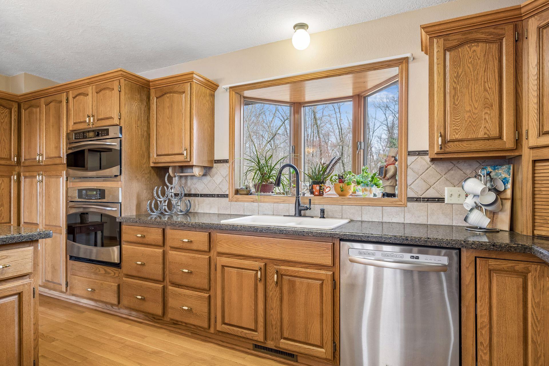 Charming bay window brings in natural light to the kitchen.