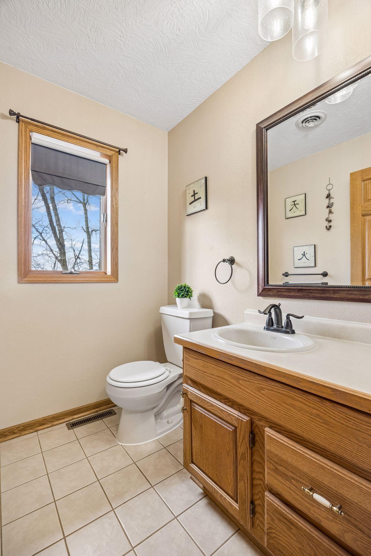 Convenient powder room located just off the kitchen.