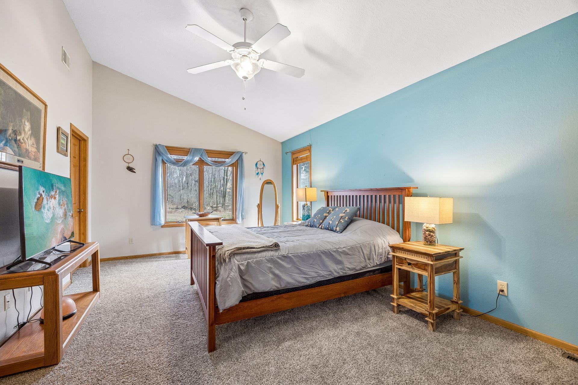 Main floor primary suite with vaulted ceilings.