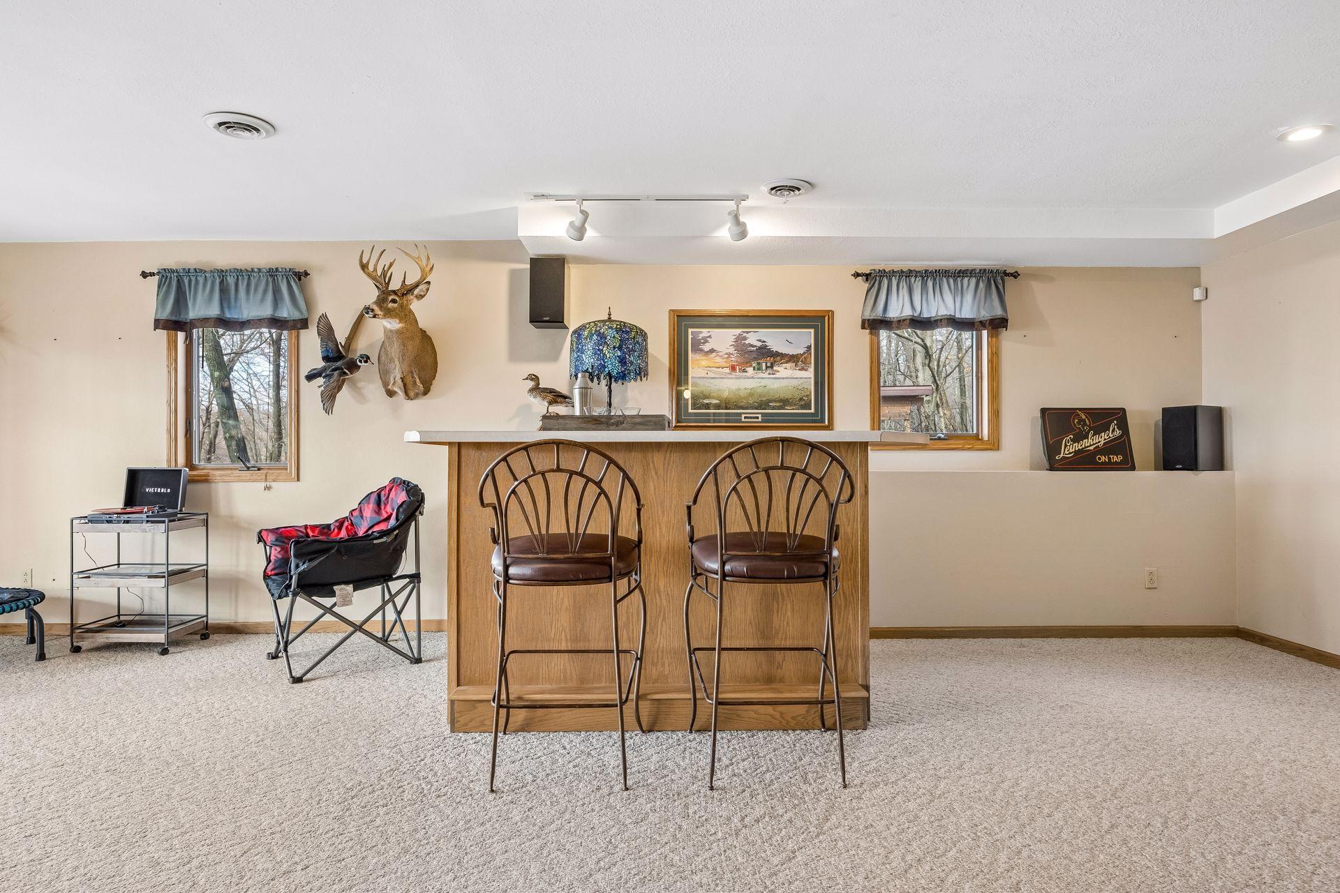 Built-in bar area with plumbing ready for a future wet bar.