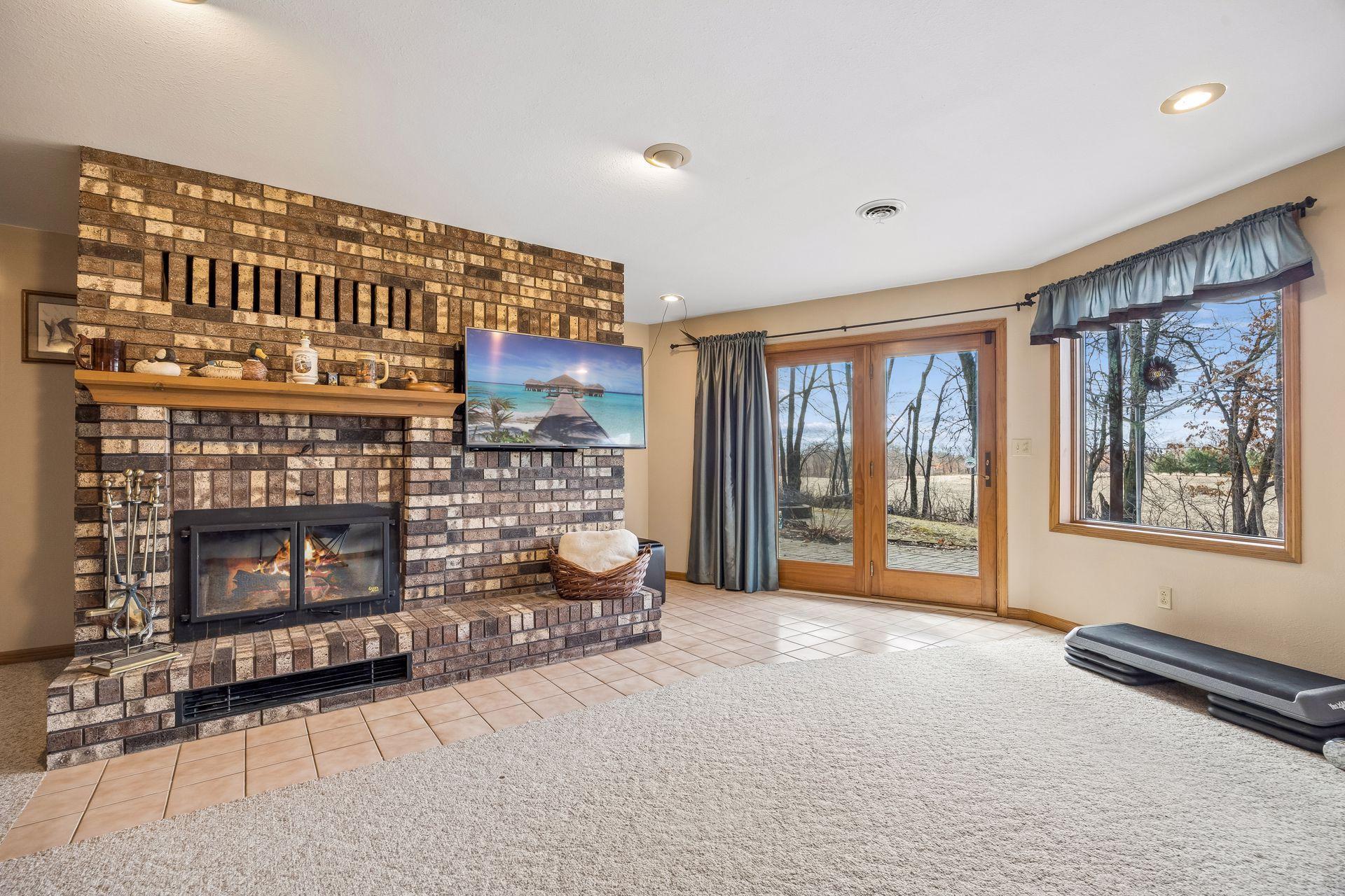 Another look at the lower level fireplace with beautiful brick detail.