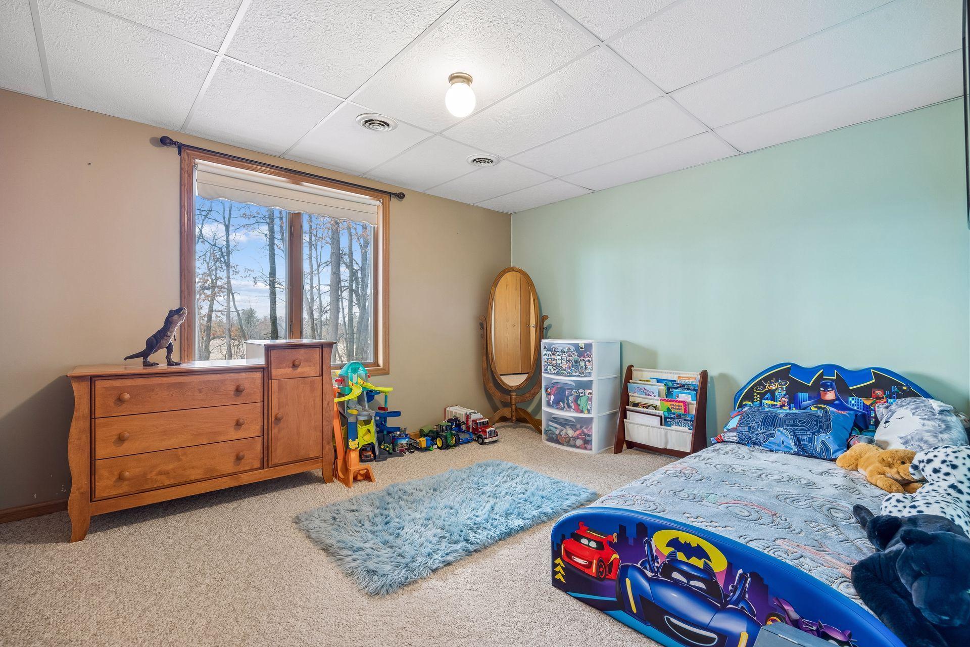 Lower level bedroom filled with natural light.