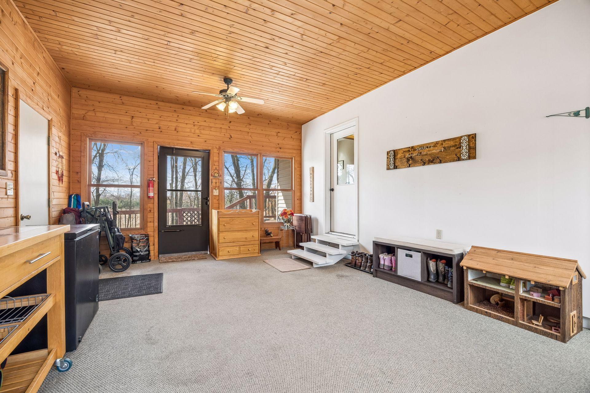 Additional breezeway view with access out to the expansive deck.