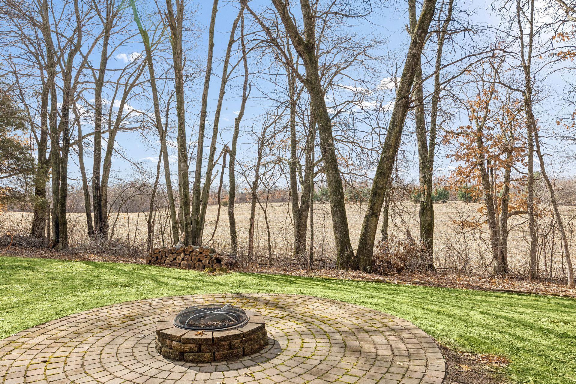 Cozy patio space with fire pit area for relaxing evenings.