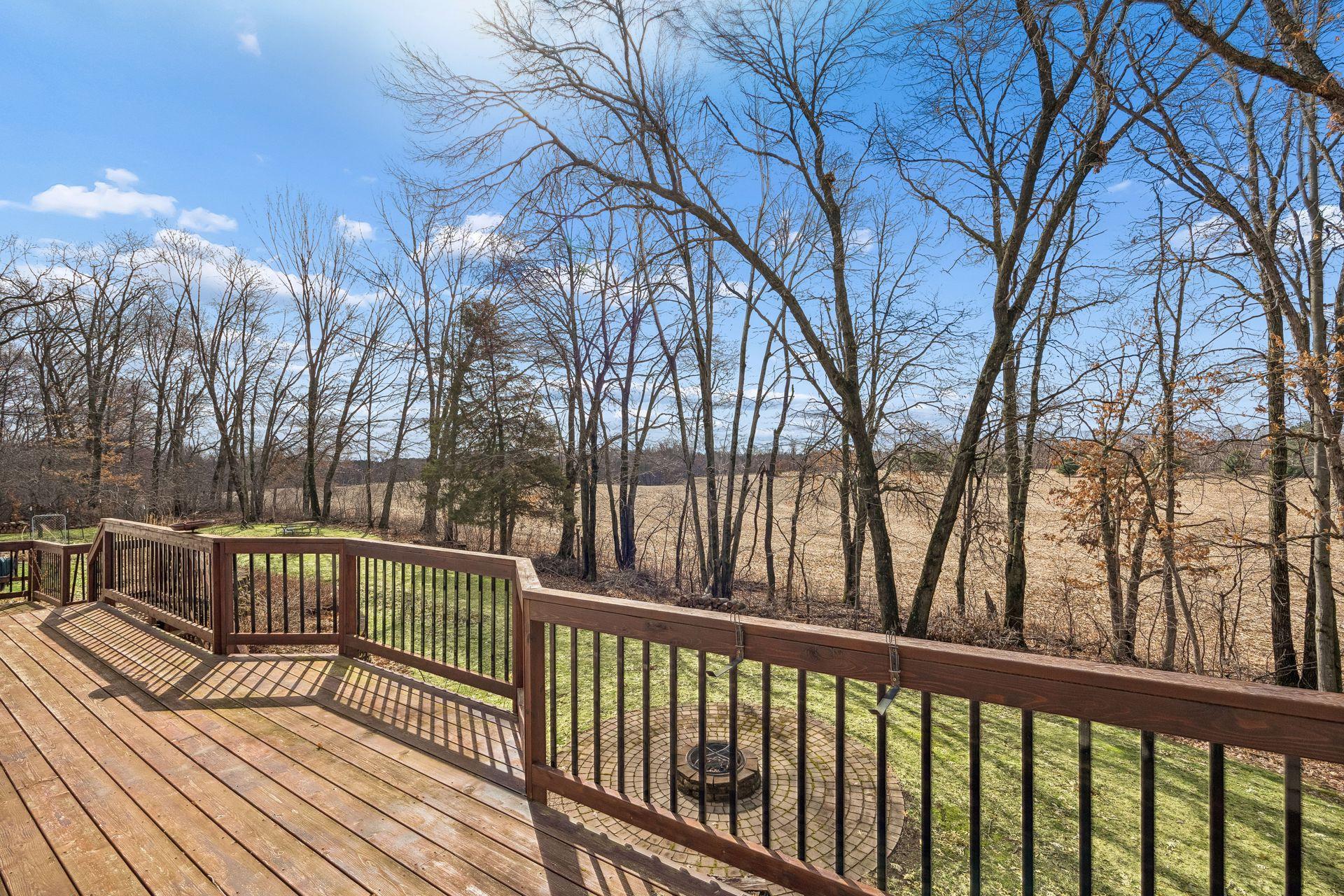 Peaceful views from the deck overlooking farmland and woods.