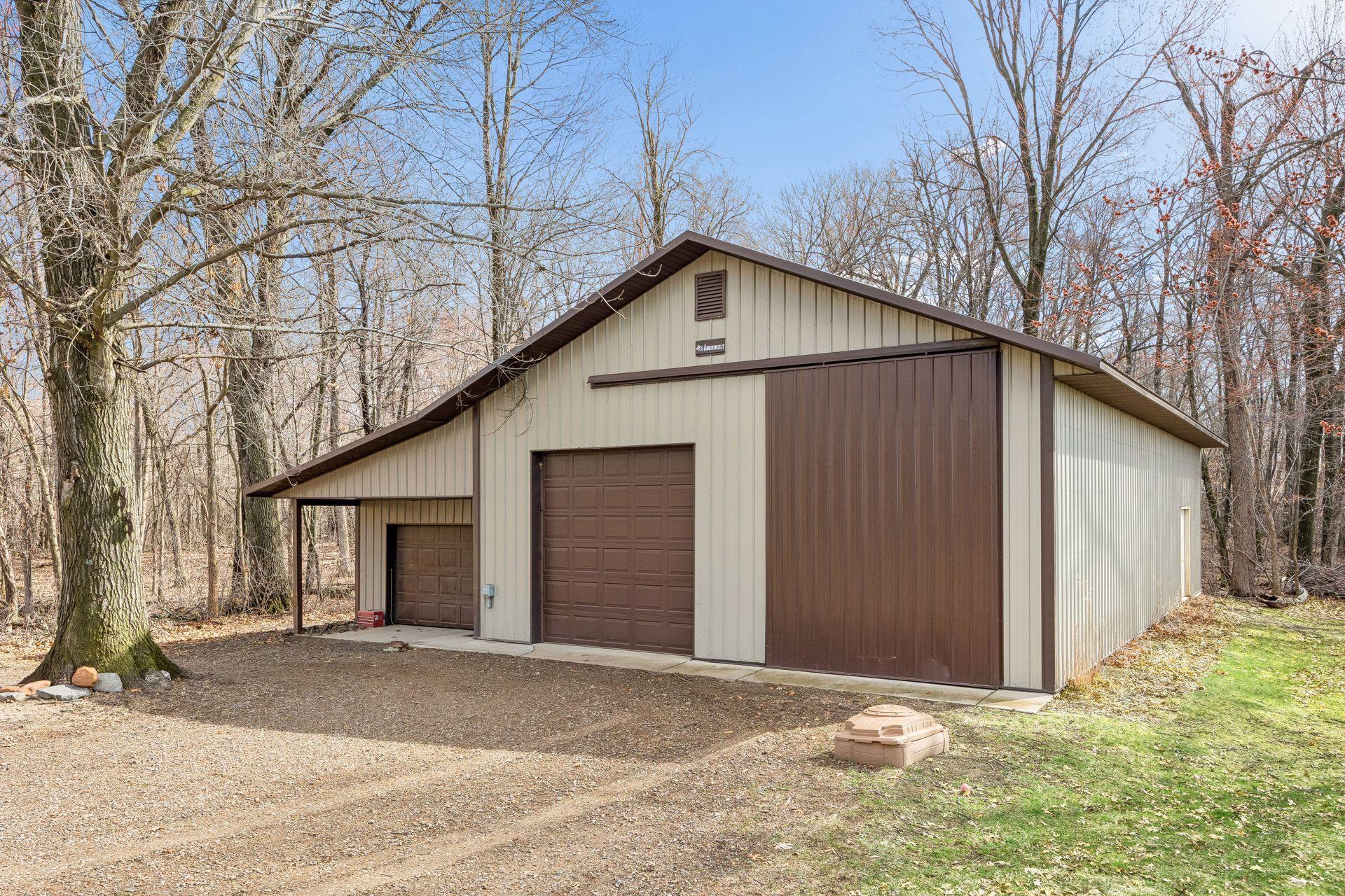 Incredible 54x30 pole barn with multiple garage doors—including a tall bay for all your toys and storage needs