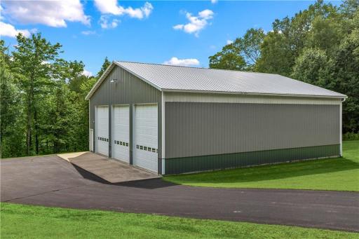 48x56 shed for all of your storage needs. This has 3- 14 foot garage doors with openers.