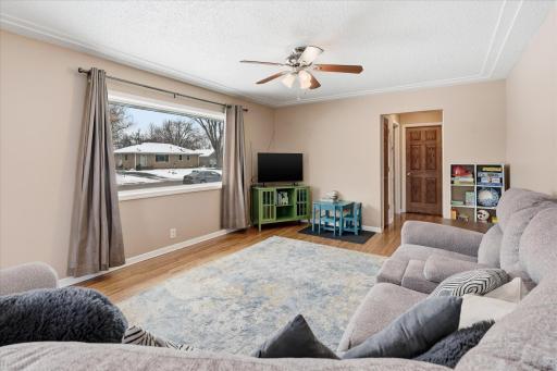 Generous main living area filled with natural light from the oversized front picture window.