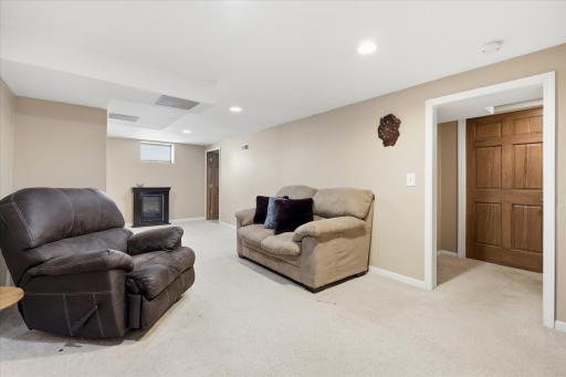 Spacious finished basement family room with recessed lighting, neutral carpet, and open layout ideal for recreation, media, or additional living space.