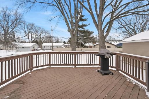 Large 15x15 deck offering plenty of room for seating and grilling, overlooking the fully fenced backyard for added privacy and usability.