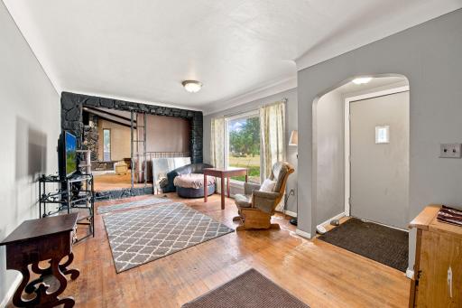 Front entry and living room. Hardwood floors.