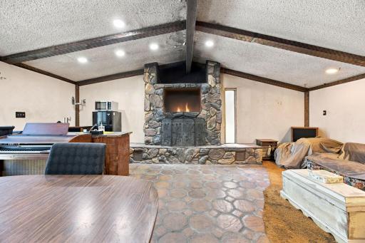 Main floor great room with wood burning fireplace