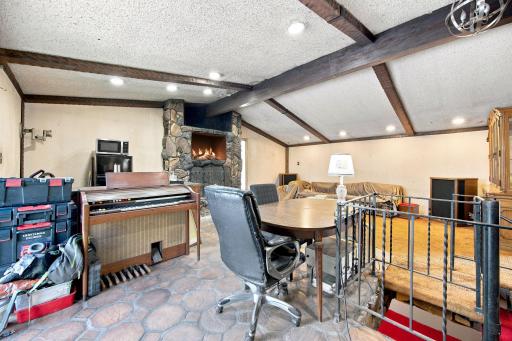 spiral steps from great room lead to the family room downstairs