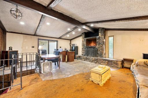 Great room with door leading to back yard/pool/covered deck.