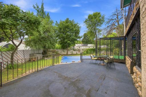Patio /deck outside kitchen leading to pool and huge back yard