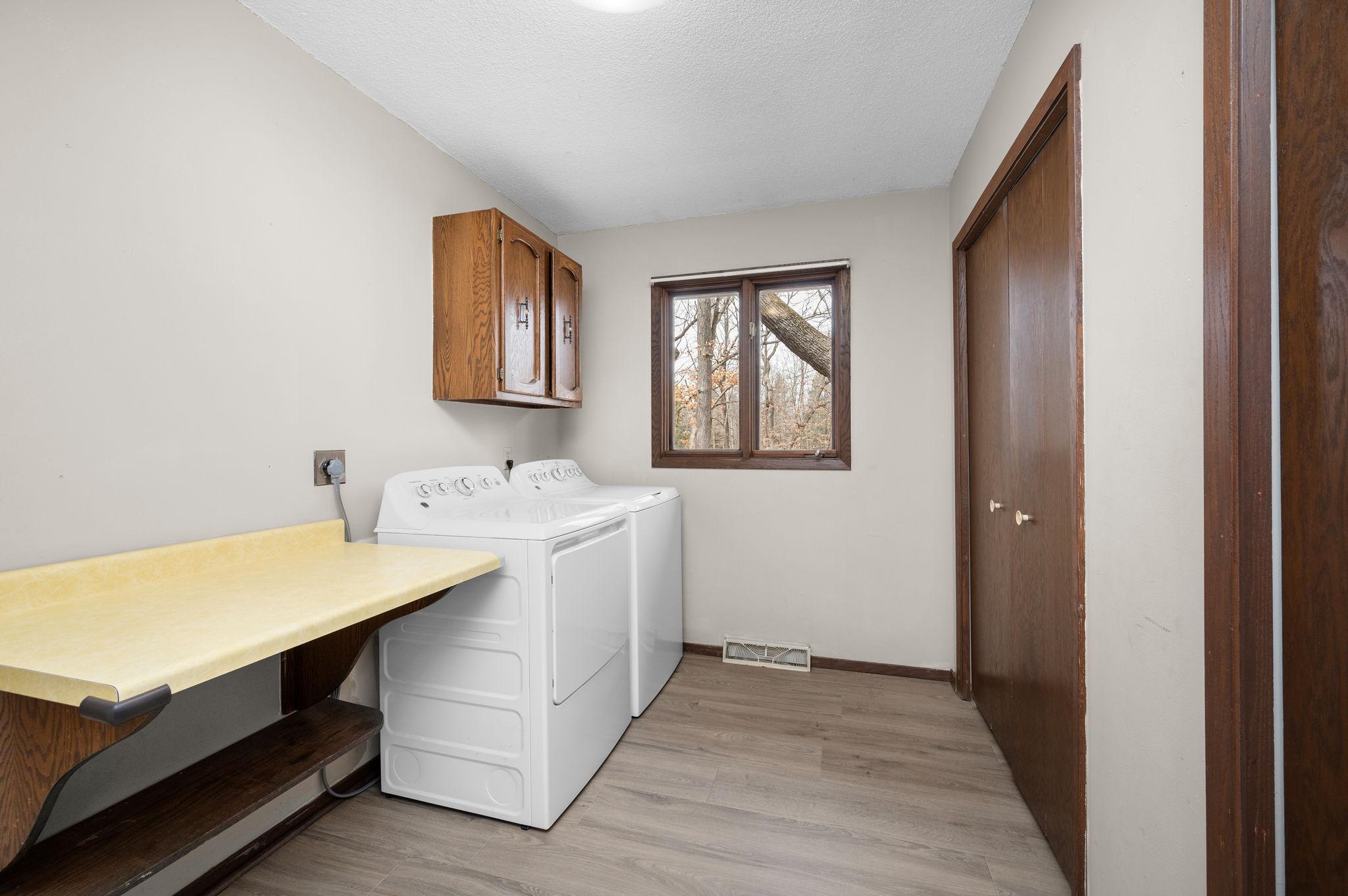Main Floor Laundry with extra storage closet
