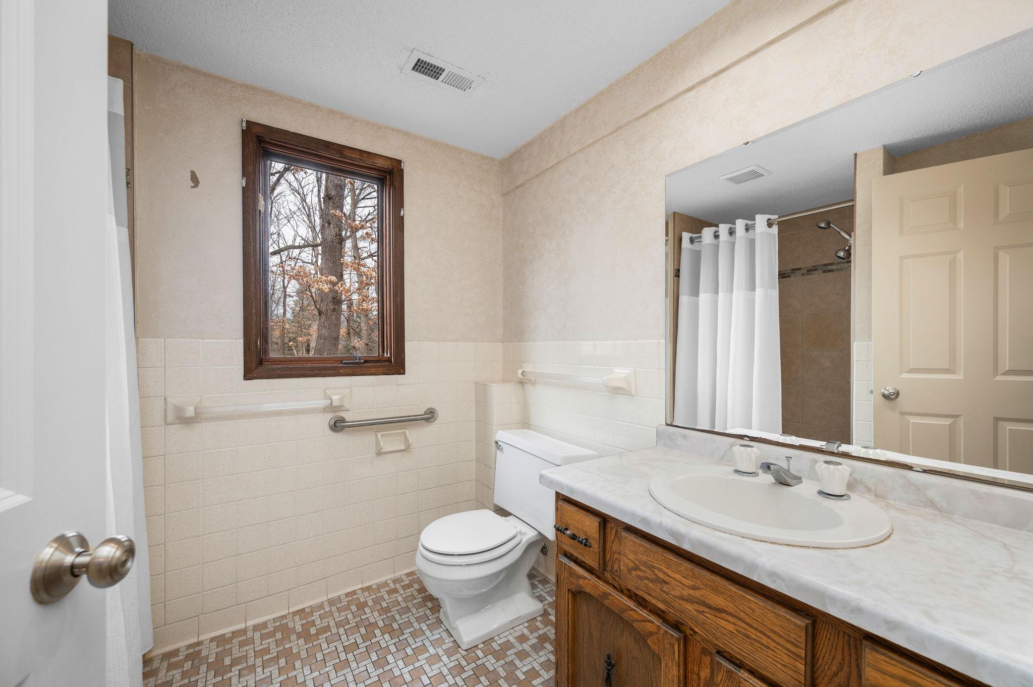 Additional 3/4 bathroom down with tile floors