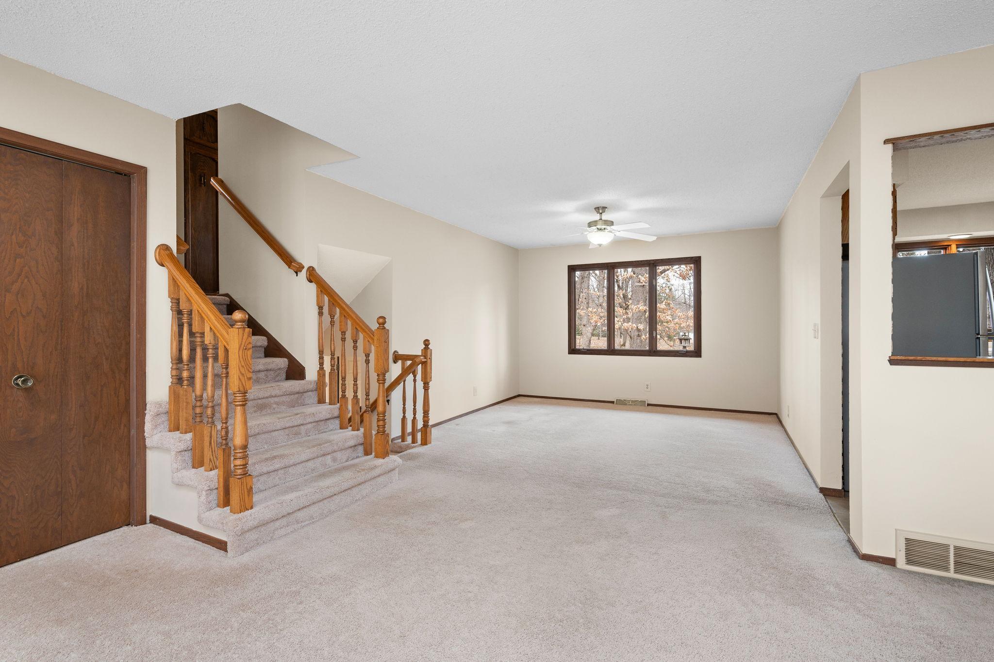 Formal Dining Room with steps open to upstairs bedrooms
