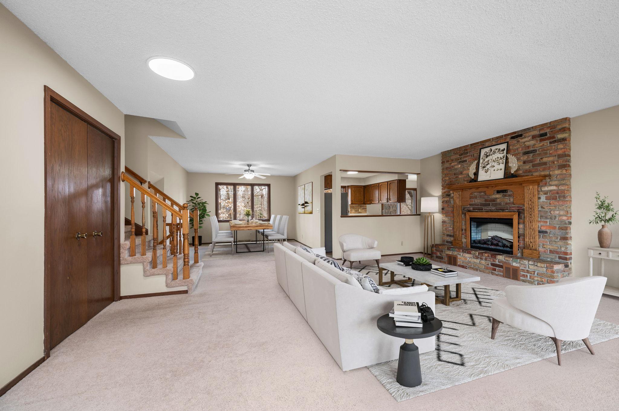 Large main floor Living Room with lots of windows and access to front deck and a formal dining room