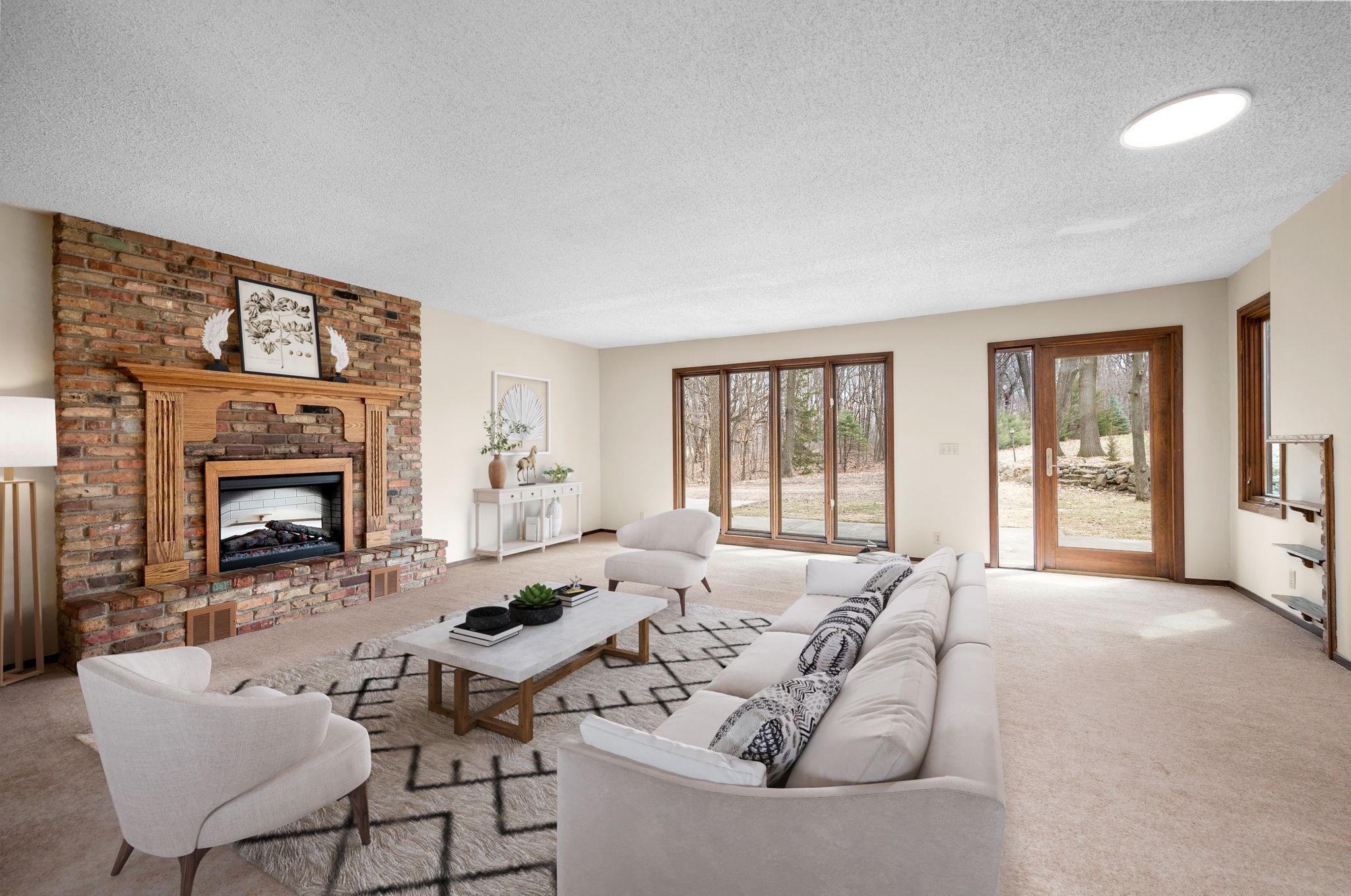 Large main floor Living Room with lots of windows and access to front deck and a formal dining room