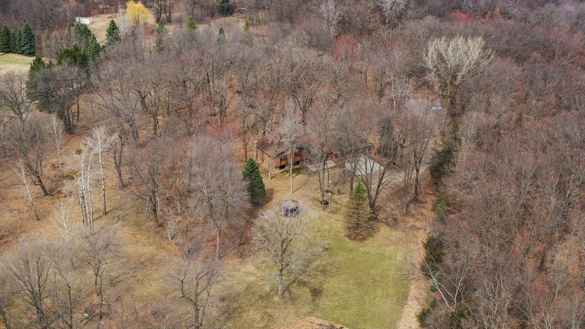 Aerial Views showcase the incredible 6.9 acres of wooded privacy!