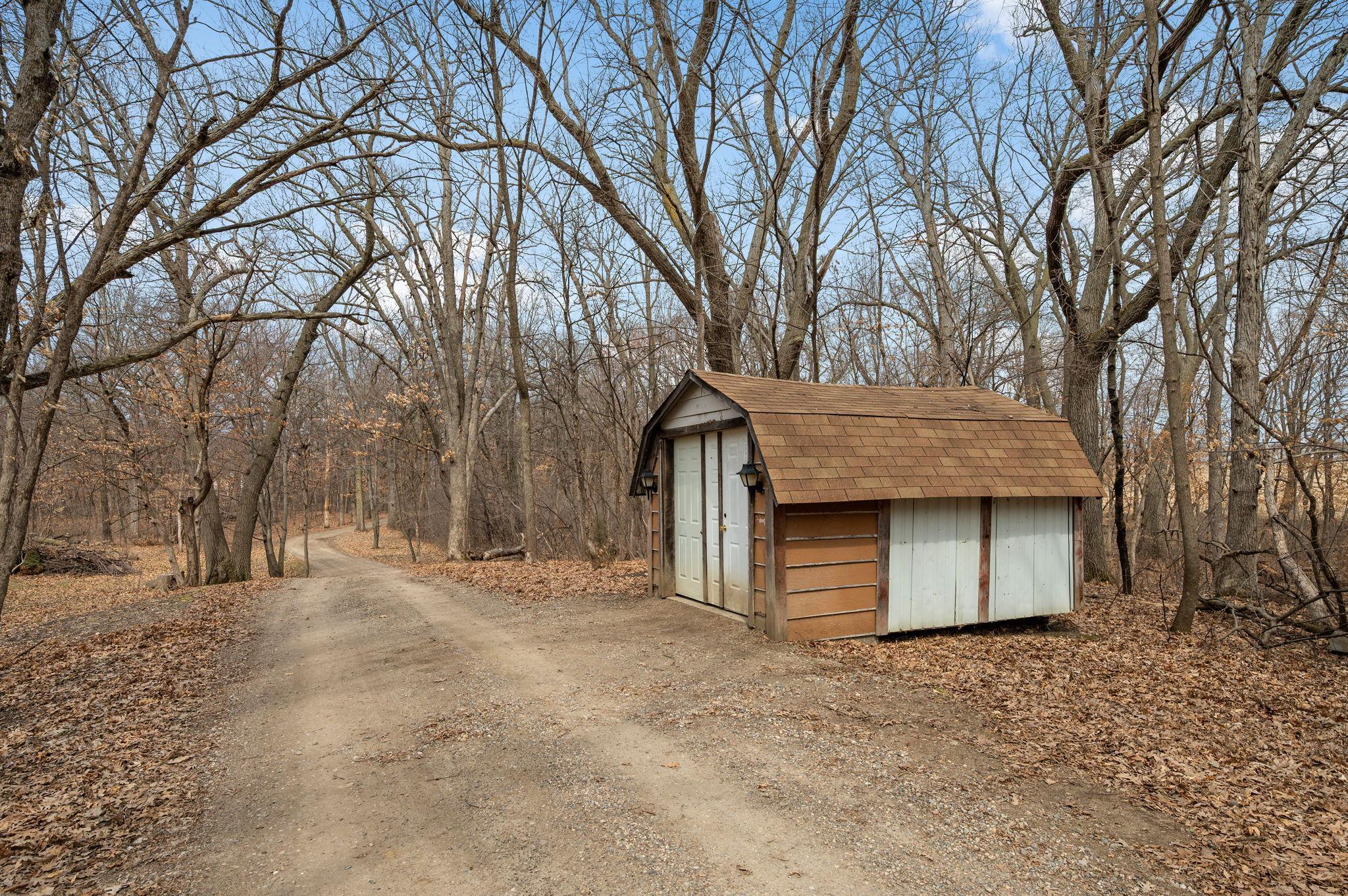 Private Driveway with extra storage sheds!
