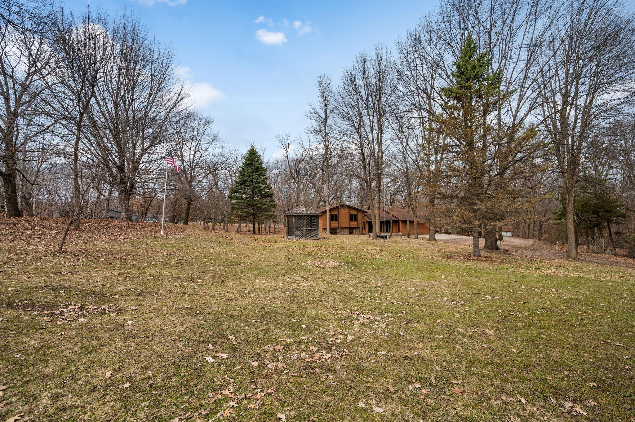 This is the home you've waited for! On 6.9 Acres Heavily Wooded Acres!