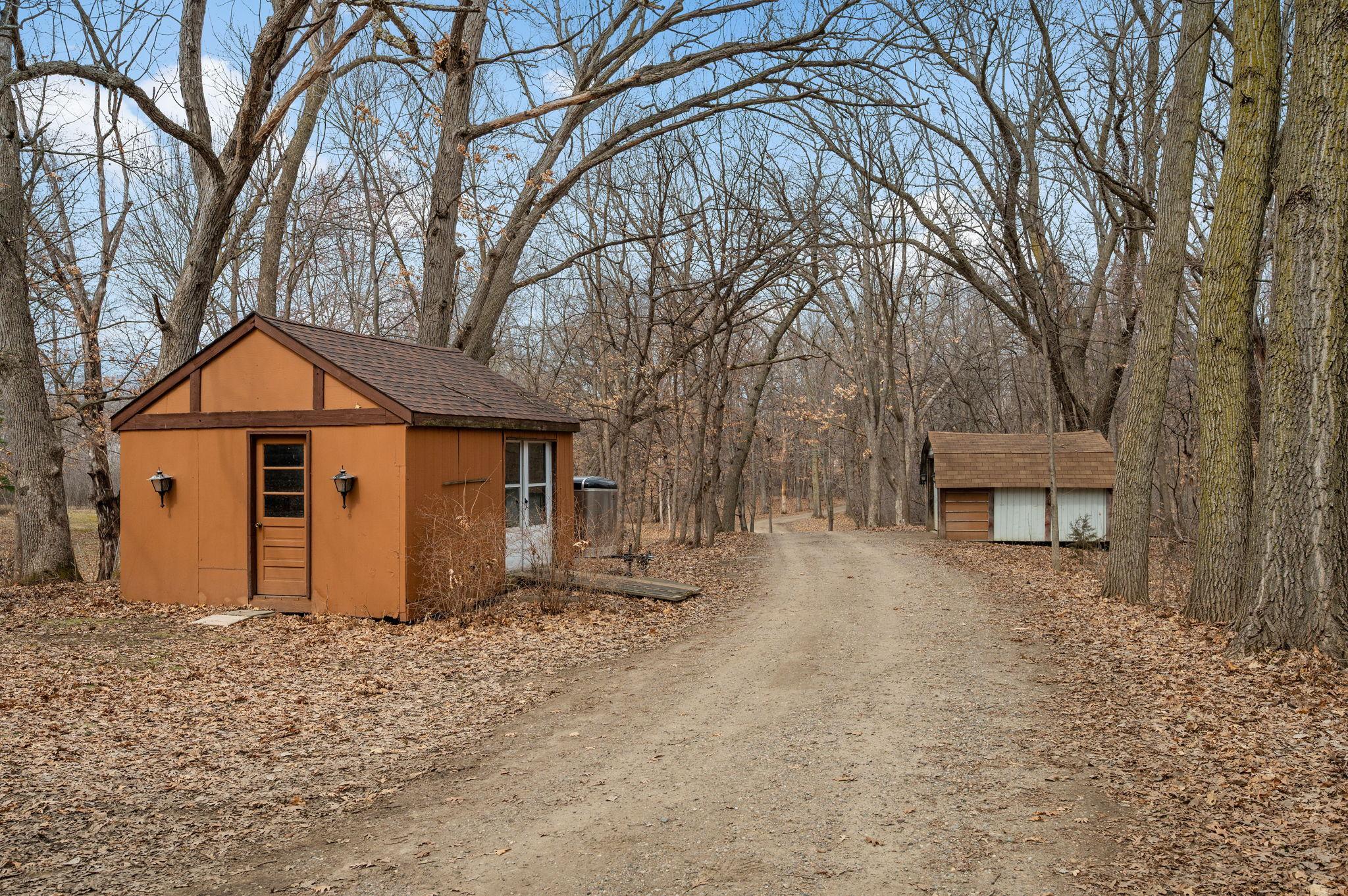 Private Driveway with extra storage sheds!